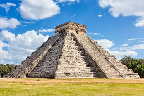 North-west view of the El Castillo (Temple of Kukulkan). El Castillo, also known as the Temple of Kukulcan, is a Mesoamerican step-pyramid that dominates the center of the Chichen Itza archaeological site in the Mexican state of Yucatán. Chichen Itza was a large pre-Columbian city built by the Maya people of the Terminal Classic period. The archaeological site is located in Tinúm Municipality, Yucatán State, Mexico.