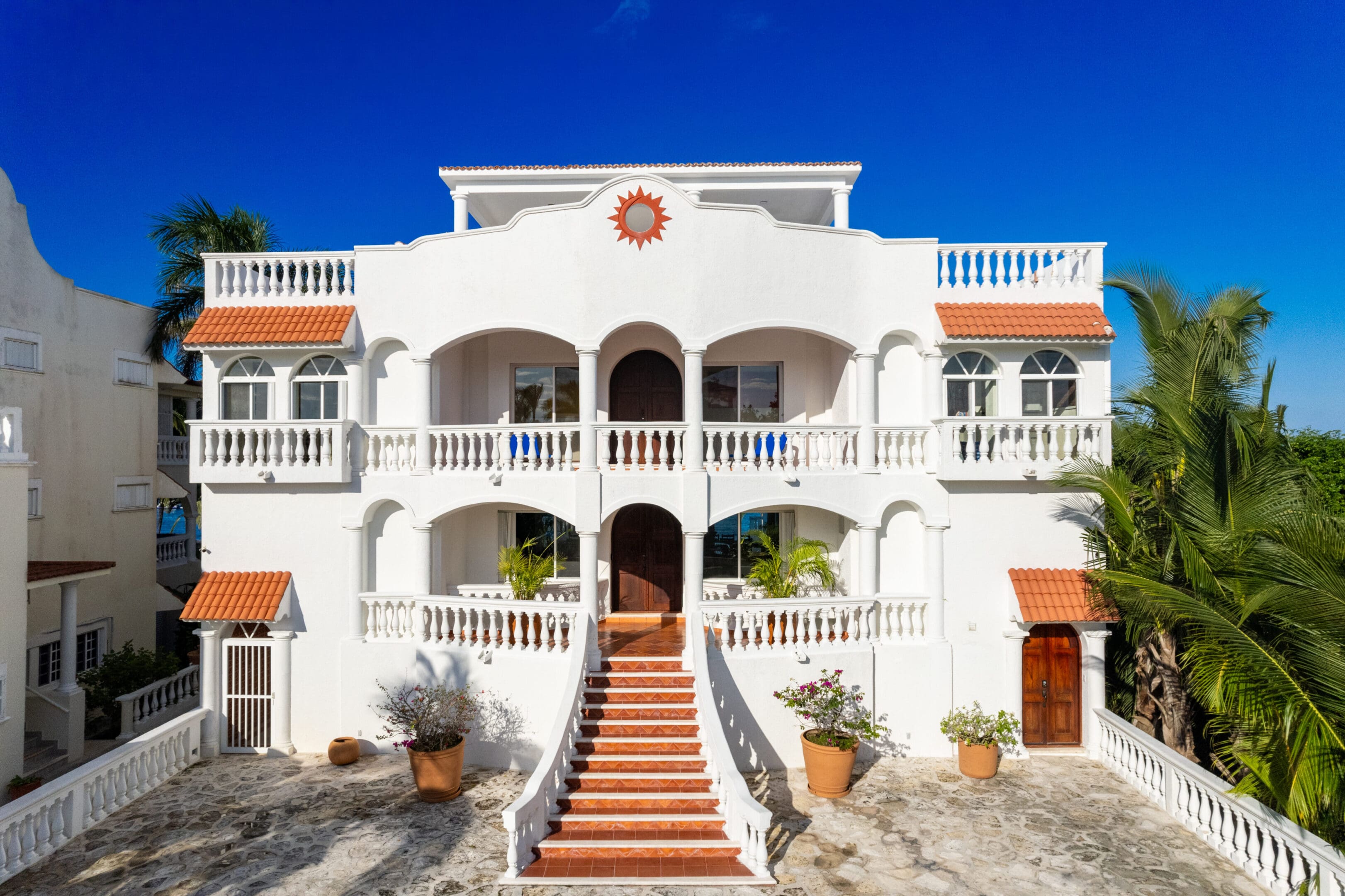 A large white building with stairs leading to the top.